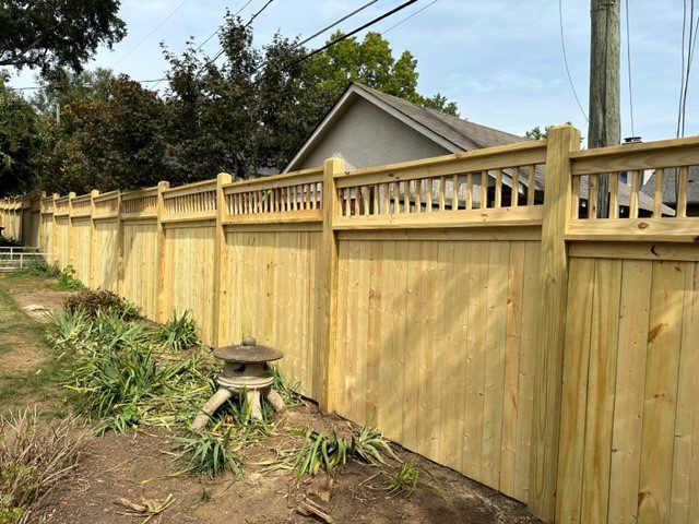 Fenceworks - Custom Wood Fence Style - 8' tall pine capped with 6x6 post, mitered post tops, stair step, and spindles Fenceworks - Custom Wood Fence Style - 8' tall pine capped with 6x6 post, mitered post tops, stair step, and spindles