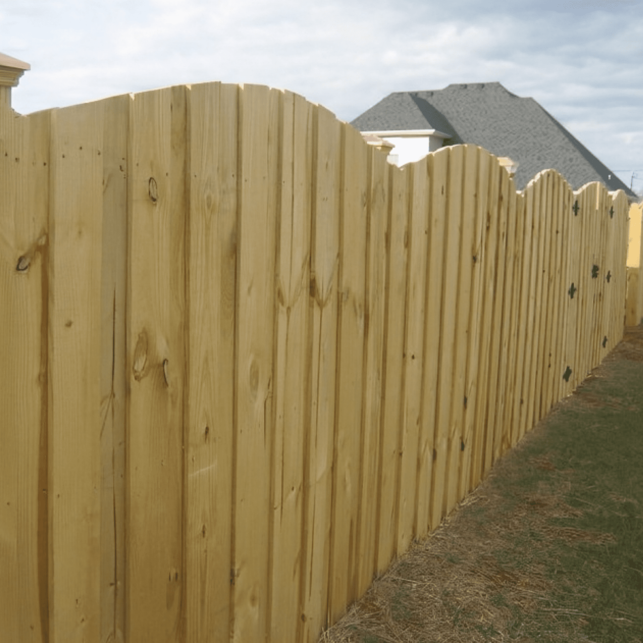 Frame 2095584584 Wooden fence beside grassy yard and house.