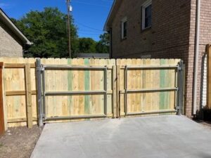 Wooden gate with metal frame, sunny day.