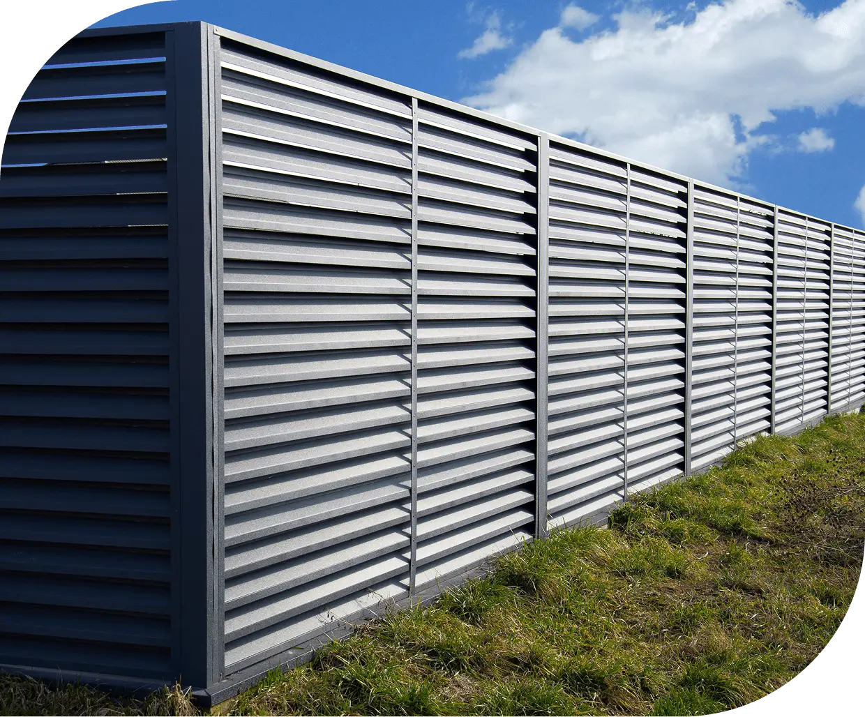 Metal fence with cloudy sky background. Metal fence with cloudy sky background.